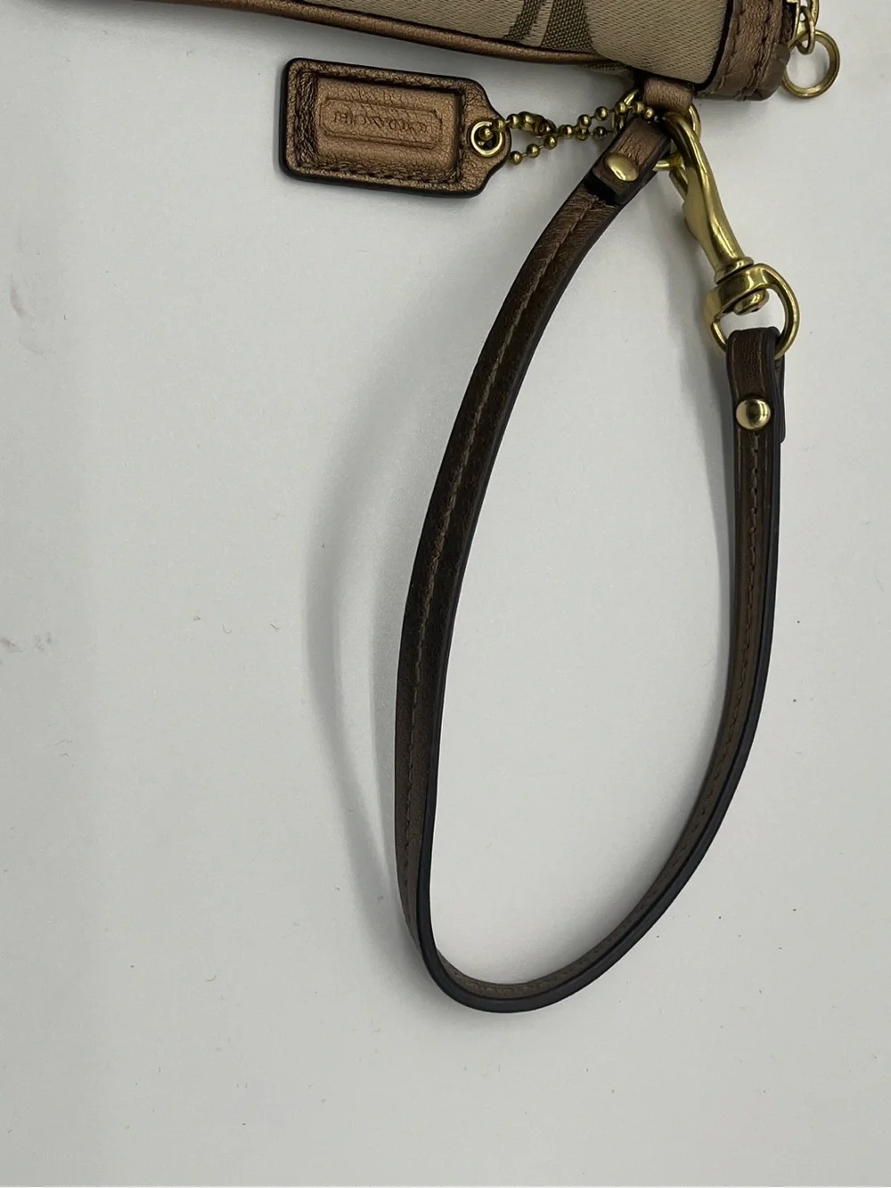 Coach Signature Logo khaki canvas and leather wristlet with 3D flower appliqué